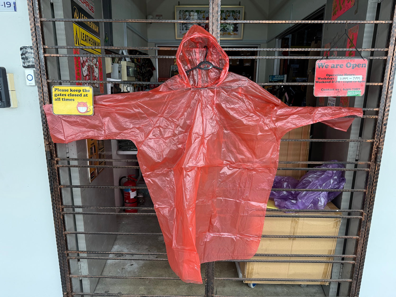 DISPOSABLE PONCHO WITH SLEEVES & DRAWSTRING HOOD