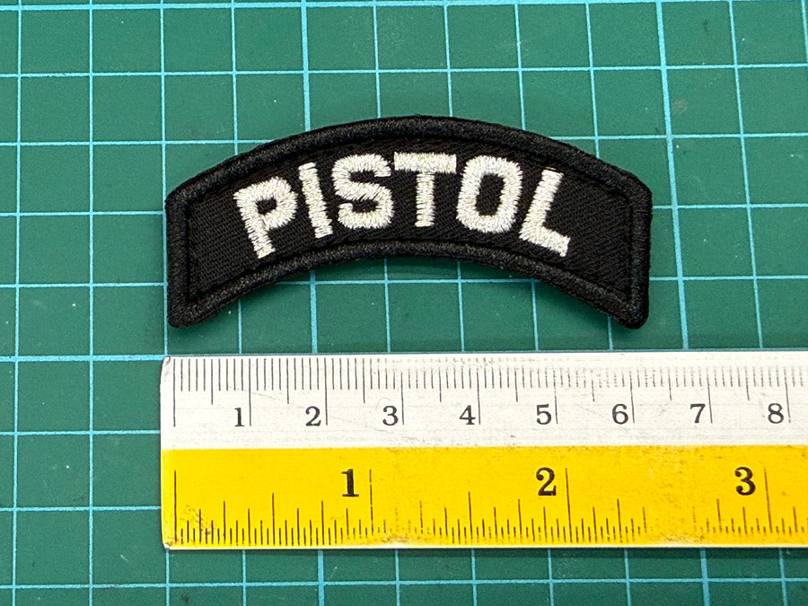 SPF Pistol Velcro Tab - 6.5 cm (Black Cloth with Metallic Silver Wording)