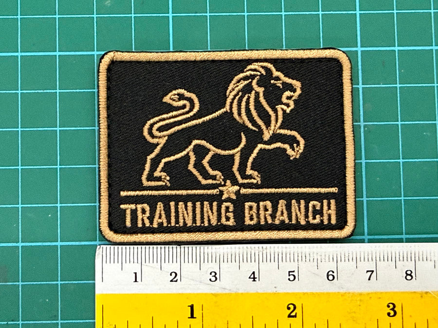 SPF Training Branch Logo Patch - 6.5 cm x 5 cm (Black Cloth with Coyote Embroidery)