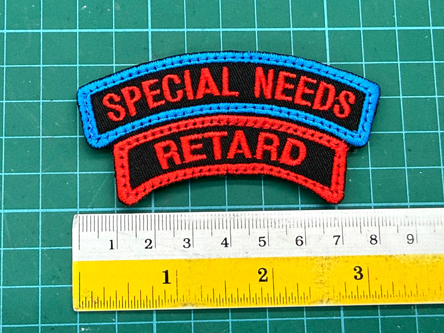 SPECIAL NEEDS X RETARD TAB - BLACK WITH RED BLUE